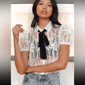 Lulu’s organza top with black tie